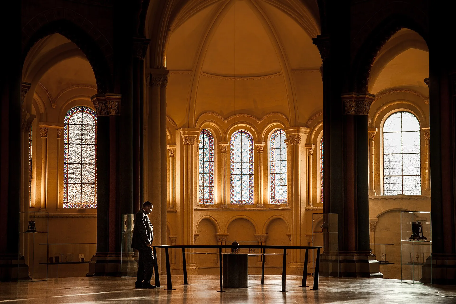 Arches and tall windows inside the Musée des Arts et Métiers