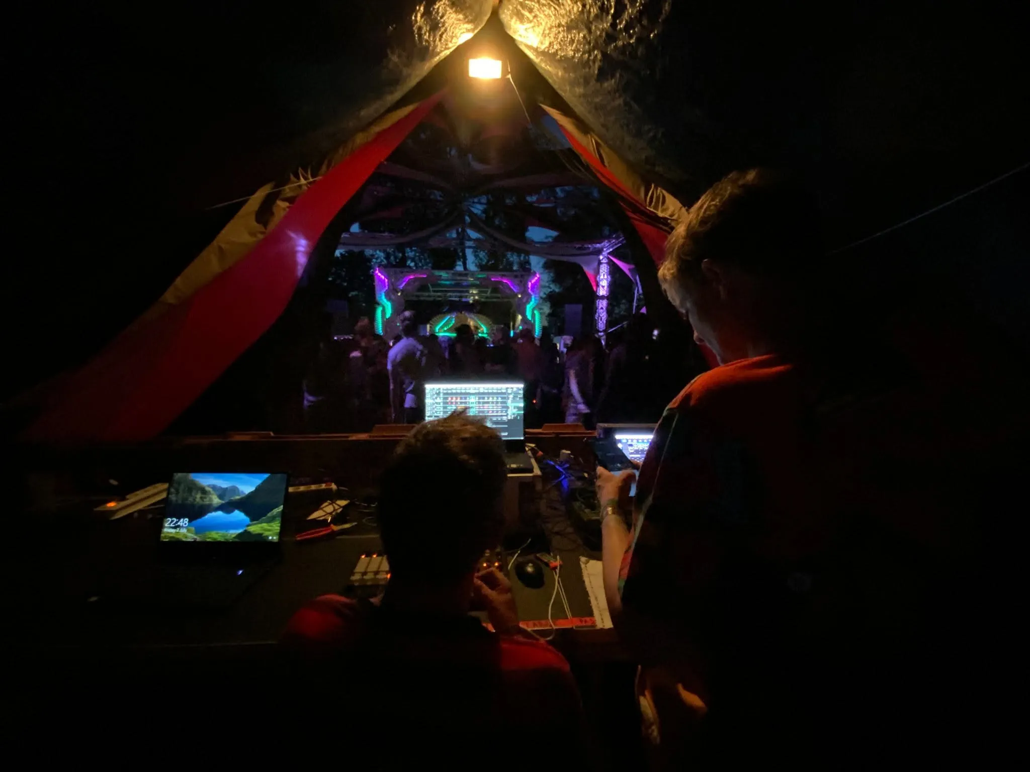 Electronic music equipment in a dimly lit stone space